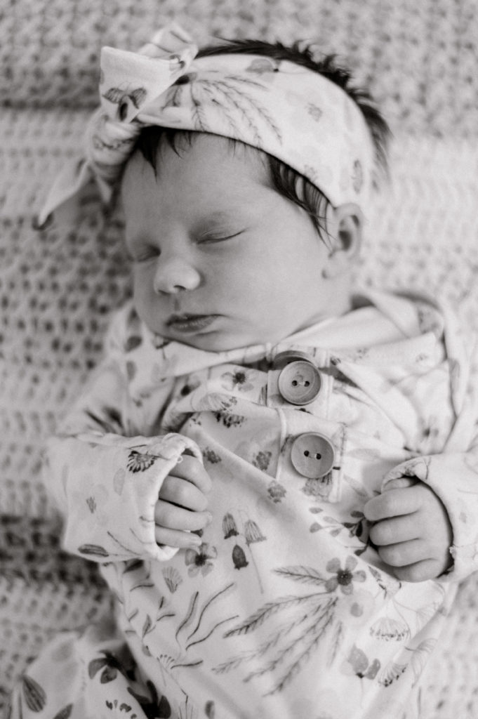 Black and white newborn girl close up in a floral nursery gown by northeast ohio newborn photographer, Brittany Serowski Photography