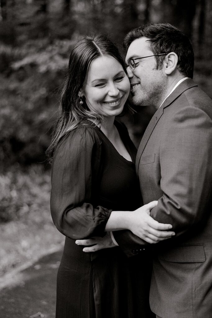 Newly expecting parents hugging one another wt by North Olmsted Maternity Photographer, Brittany Serowski Photography.