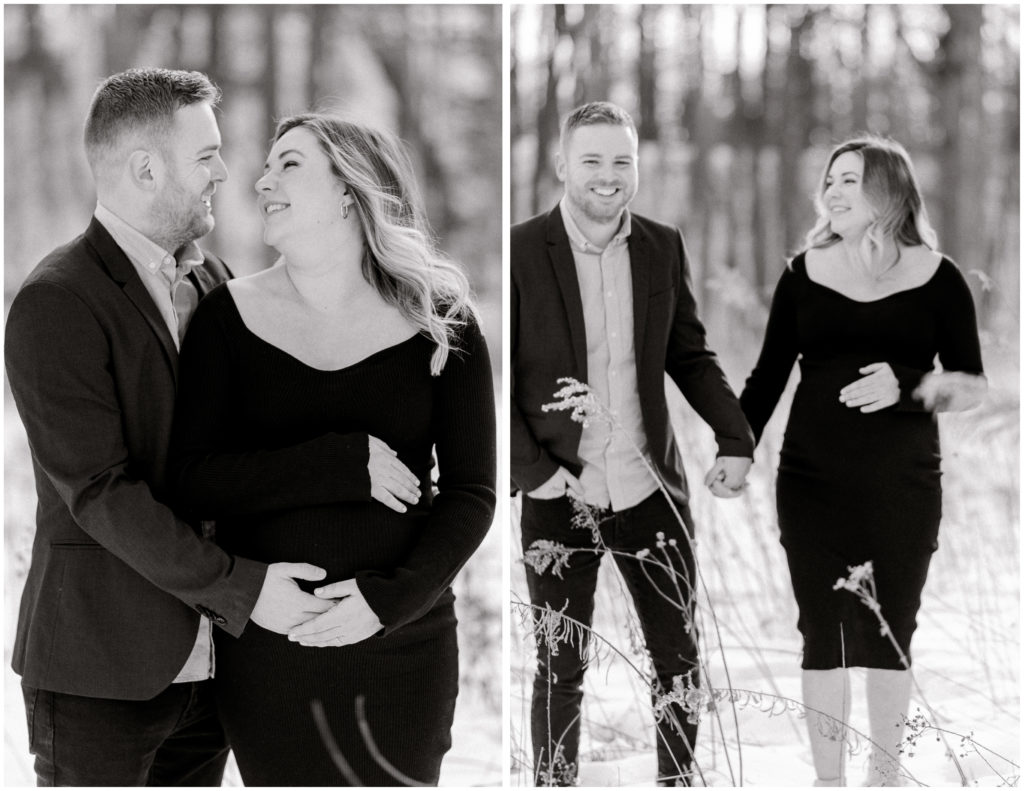 A black and white photo of a couple snuggled close together and walking hand in hand laughing as they walk through the snow by Cleveland Maternity Photographer, Brittany Serowski Photography.