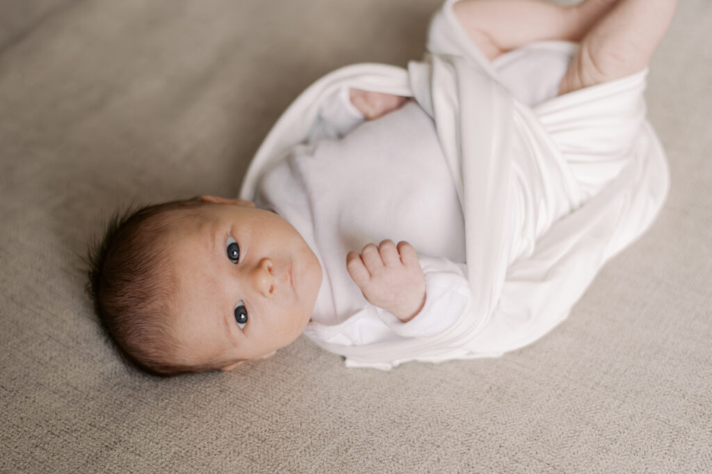 Light and airy newborn photo taken in Cleveland home during snowy season by Cleveland Newborn Photographer, Brittany Serowski Photography.